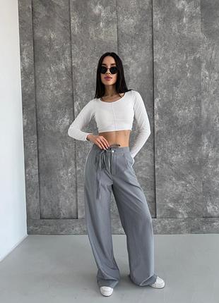 Брюки свободного покроя с лампасами на пуговице