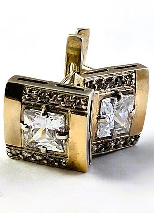 Серебряные сережки с золотыми пластинами и камнями.