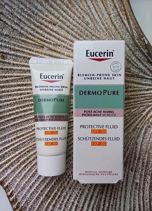 👒сонцезахисний флюїд проти постакне для проблемної шкіри eucerin dermopure protective fluid spf 30 зменшує плями від прищів мініатюра/пробник 7мл.