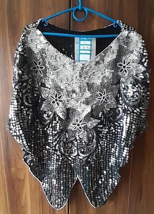 Блузка з паєтками.