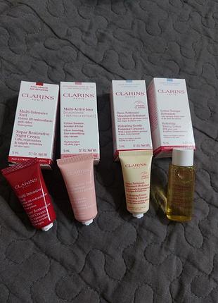 Набор миниатюр clarins для ухода за лицо крем, тоник, крем пенка