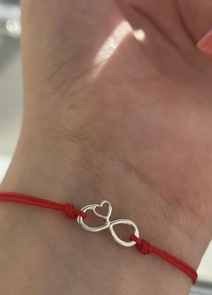 Серебряный браслет на нитке