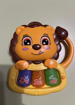 Музыкальная игрушка львенок