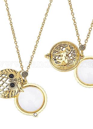 Лупа із стразами на ланцюжку.