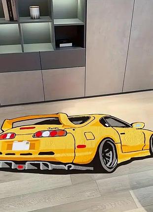 Килим з оранжевим спортивним автомобілем з спойлером