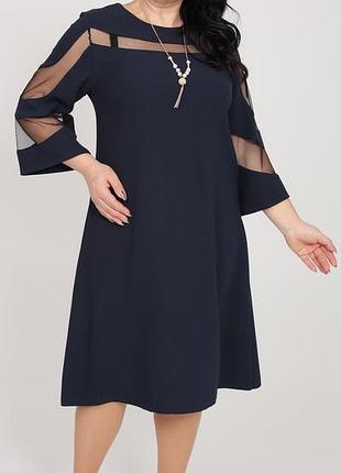 Нарядное женское платье темно-синего цвета