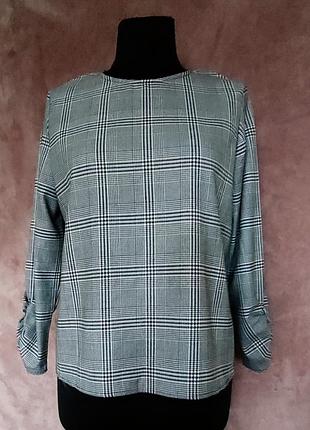 Блуза сірого кольору у клітку