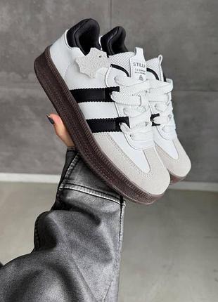 Стильні жіночі кеди натуральна шкіра колір білий сірий на коричневій підошві