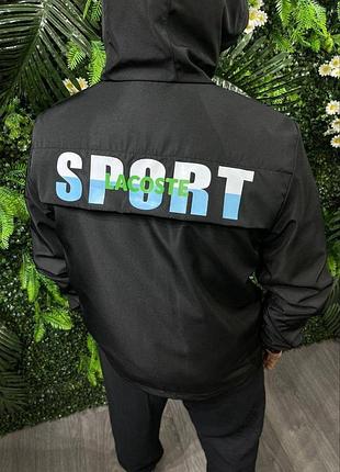 Мужская черная ветровка куртка с крупной надписью на спине lacoste
