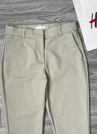 Ніжно фісташкові брюки h&m