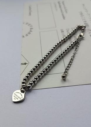 Браслет с сердцем в стиле бренда