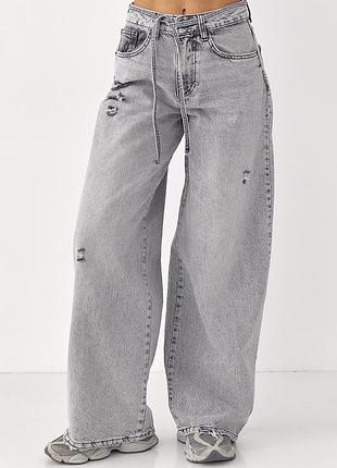 Джинсы wide leg с дырками и потертостями
