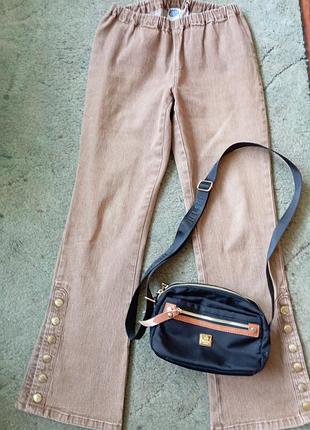 Джинсы клеш на кнопках