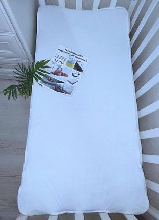 Наматрацник водонепроникний з резинкою по кутам у дитяче ліжечко 120*60см