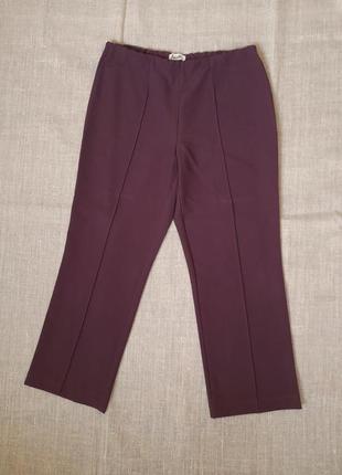 Стрейчевые женские брюки на резинке сиреневого цвета