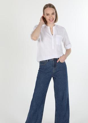 Біла жіноча блузка жатка