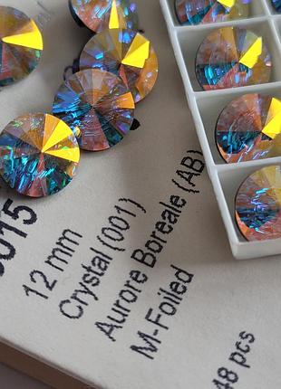 Swarovski  rivoli  - 3015 гудзики  12 mm 
цвет -crystal аurore boreale &nbsp;
цена указана за 1 шт.