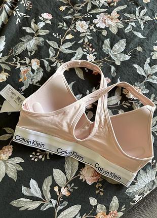 Бюстгальтер топ рожевий calvin klein BDS secret xs s дії4 фото
