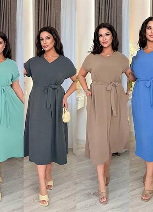 Платье свободного кроя, с карманами.