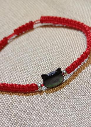 Браслет плетёный с перламутровым котиком.