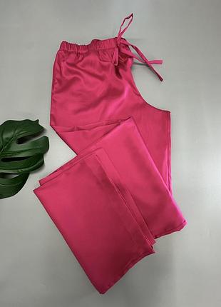 Розові шовкові штани з карманами