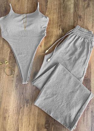 Жіночий сірий костюм боді і палаццо жатка