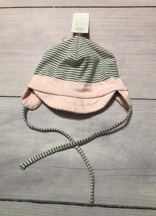 Шапка трикотажна на зав'язках з козирком