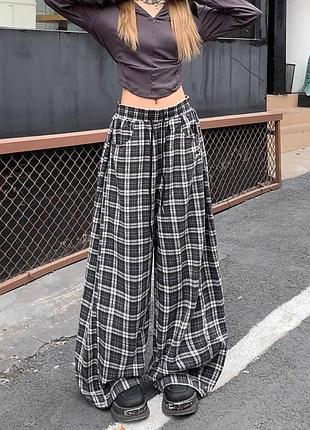 Жіночі штани в клітинку клітчаті картаті коричневі чорно-білі широкі палаццо фланелеві натуральні