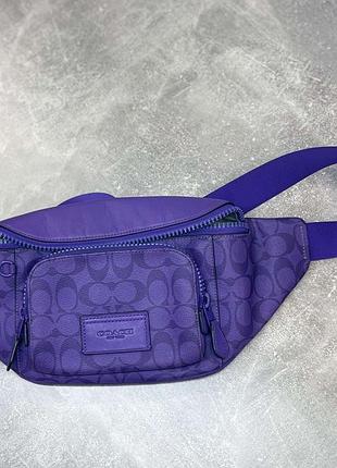 Сумка фиолетового цвета coach