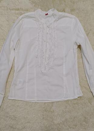 Біла бавовняна блуза з рюшами і коміром стійка