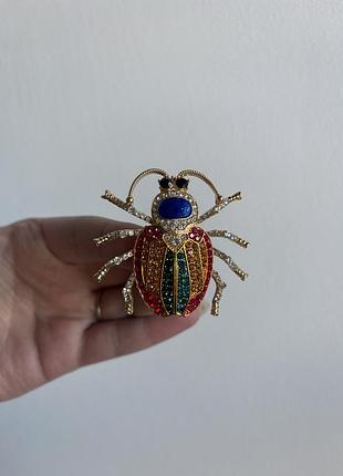 Металева брошка королівський жук