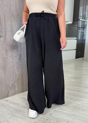 Жіночі літні широкі штани палаццо на резинці жатка весна літо чорні