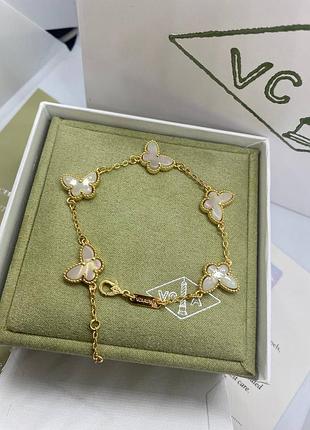 Браслет метелики перламутр ван золотистого кольору