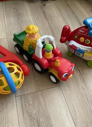 Музичний трактор fisher price, каталка technok, музичний вертоліт vtech