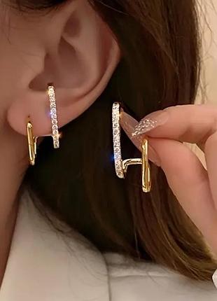 Золотистые серьги в стразах линии, 1114
