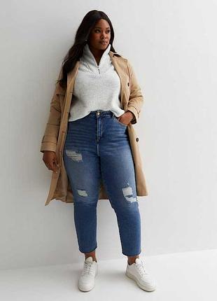 Стильні джинси на високій посадці з потертостями