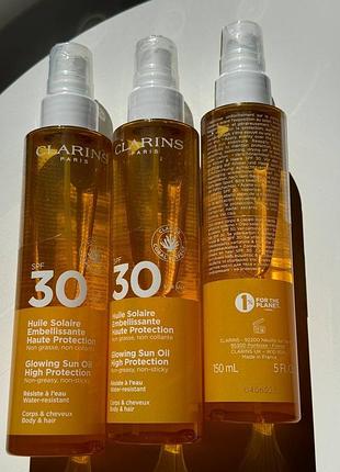 Сонцезахисне масло для тіла clarins glowing sun oil spf 30  повний формат 150ml