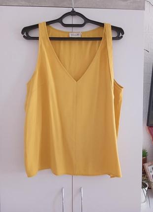 Желтая стильная блуза.
