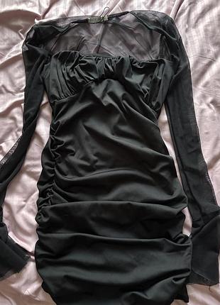 Чорне плаття,з рукавами у сітку, приємної якості, дуже гарно підкреслює талію