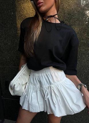 Трендова цього сезону романтична спідниця з бантиками