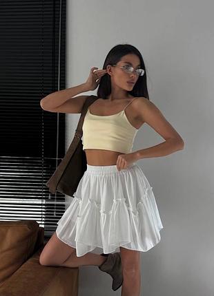 Жіноча спідниця літня з клинами вільного крою жовта біла