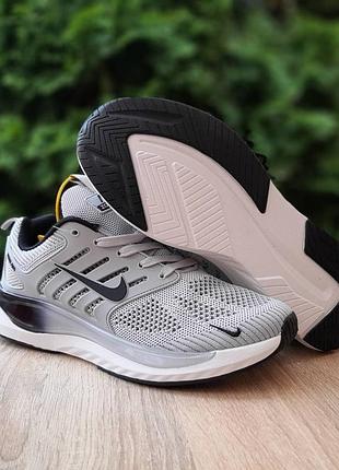 Стильні чоловічі кросівки nike сірого кольору сітка текстиль на шнурівках.