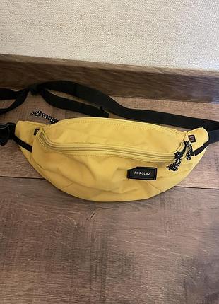 Forclaz сумка поясна travel жовта 2 кармани