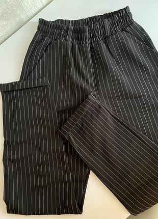 Брюки/штани у смужку