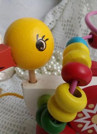 Игрушка деревянная каталка на колесиках утка на веревочке уточка4 фото