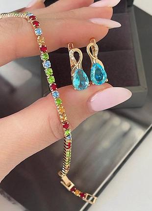 Интересный набор медсплав медзолото, фианиты камушки разноцветные, браслет в камушках и серьги с голубым камнем