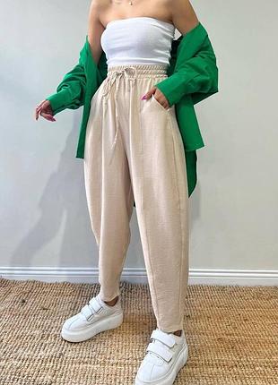 Жіночі бежеві легкі штани жатка