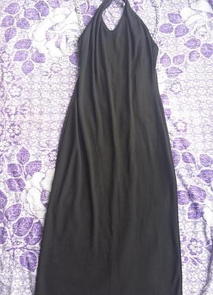 Приталене, довге плаття з металевими кільцями, з відкритою спиною. розмір m-l. матеріал трикотаж.