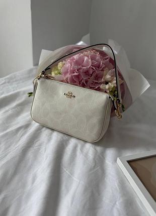 Сумка coach nolita shoulder bag in signature canvas