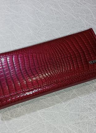 Новий шкіряний гаманець у коробці, розмір гаманця 19х9х3 см.